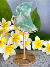 Load image into Gallery viewer, Green Snowflake Fluorite Crescent Moon On Gold Metal Stand
