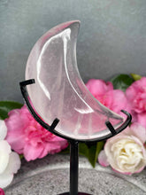 Load image into Gallery viewer, Transparent Rose Quartz Crystal Crescent Moon Carving On Black Stand
