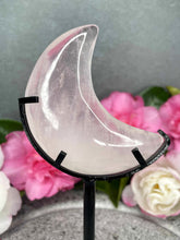 Load image into Gallery viewer, Soft Rose Quartz Crystal Crescent Moon Carving Black Stand
