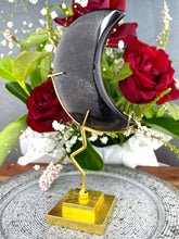 Load image into Gallery viewer, Stunning Silver Sheen Obsidian Crescent Moon On Gold Stand
